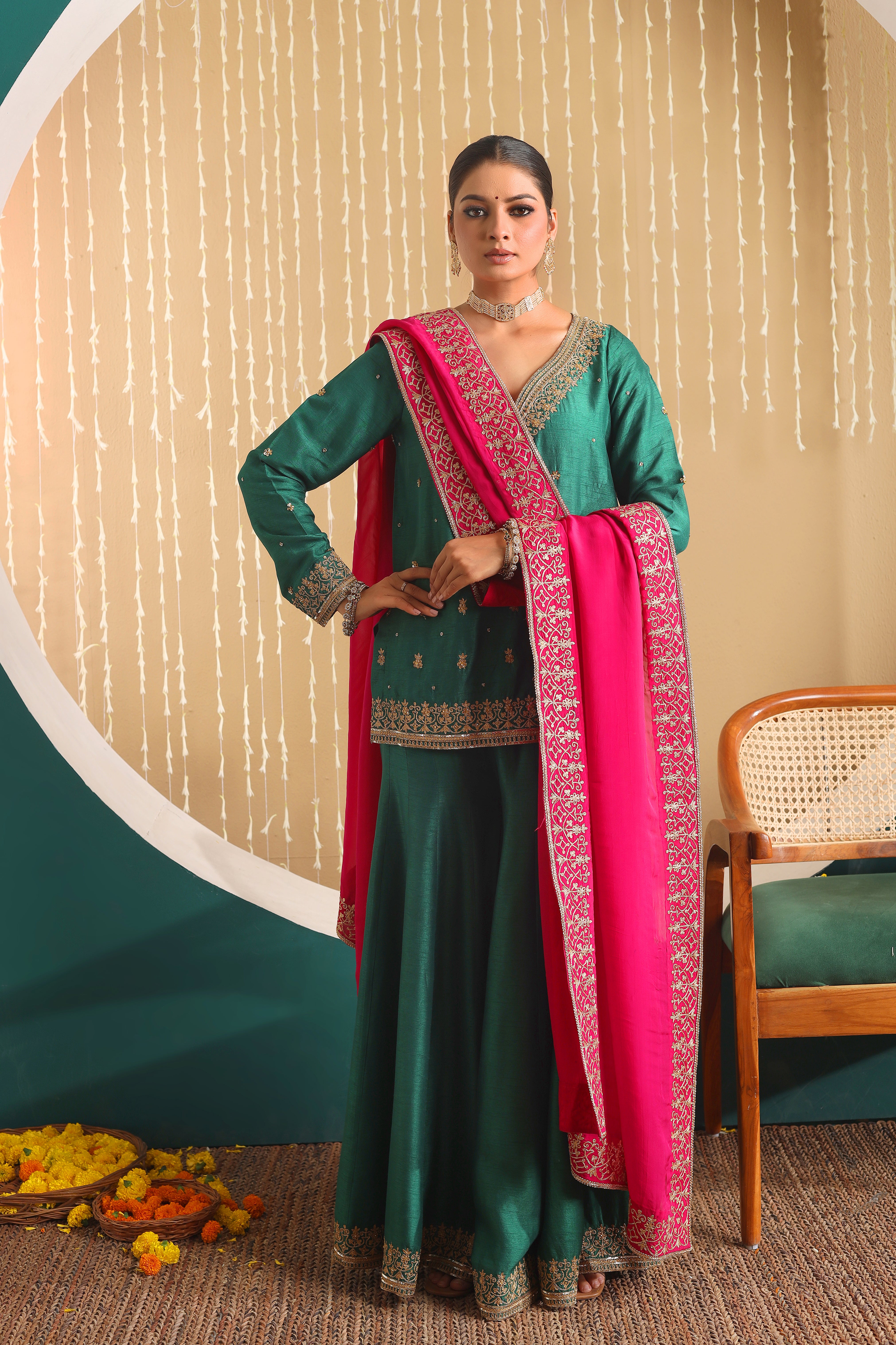 GULBANO - Green row silk pure hand embroidered sharara set with pink organza dupatta.