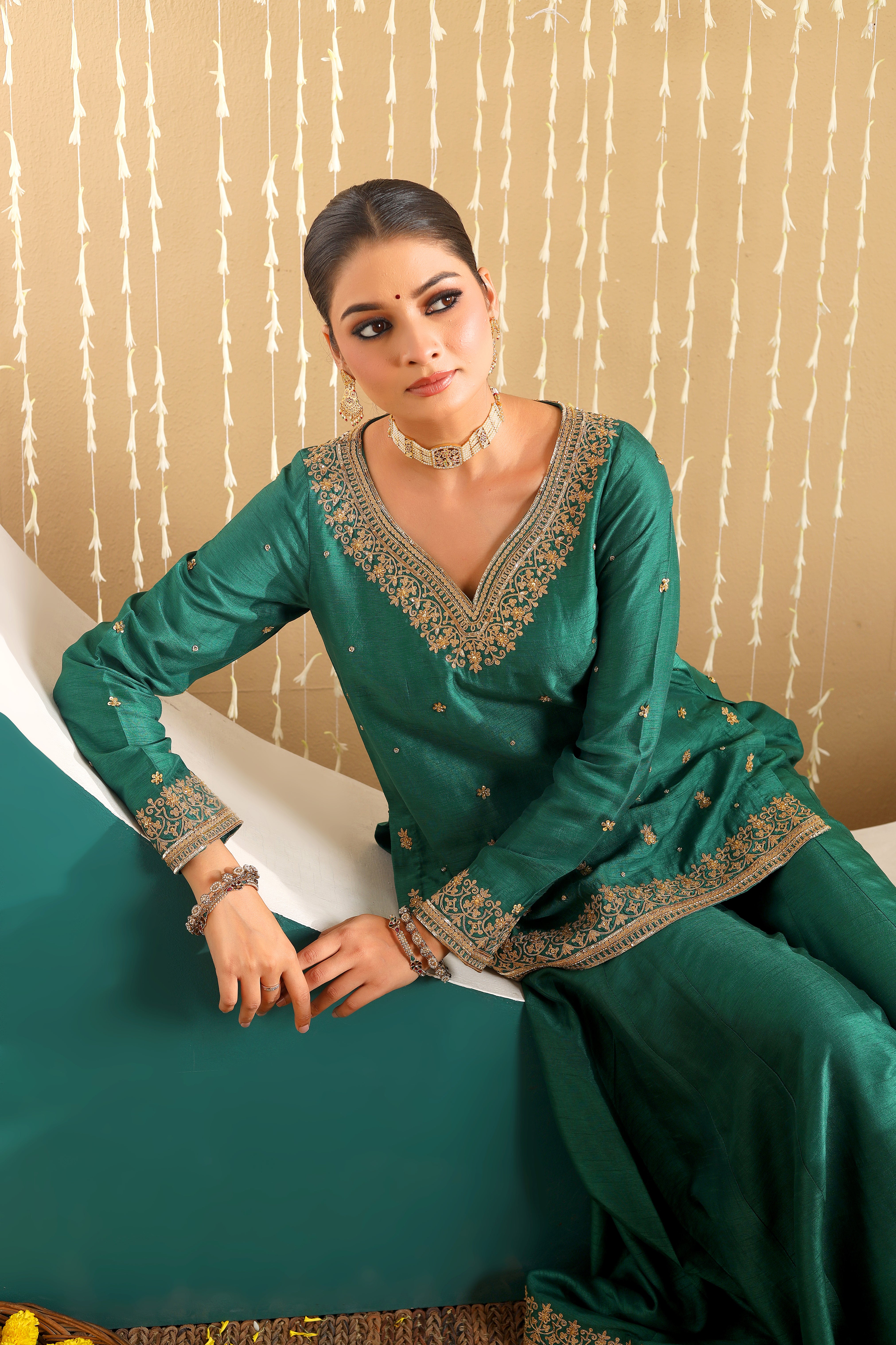 GULBANO - Green row silk pure hand embroidered sharara set with pink organza dupatta.